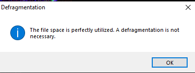 Defragmentation dialog reading: The file space is perfectly utilized. A defragmentation is not necessary. OK button visible