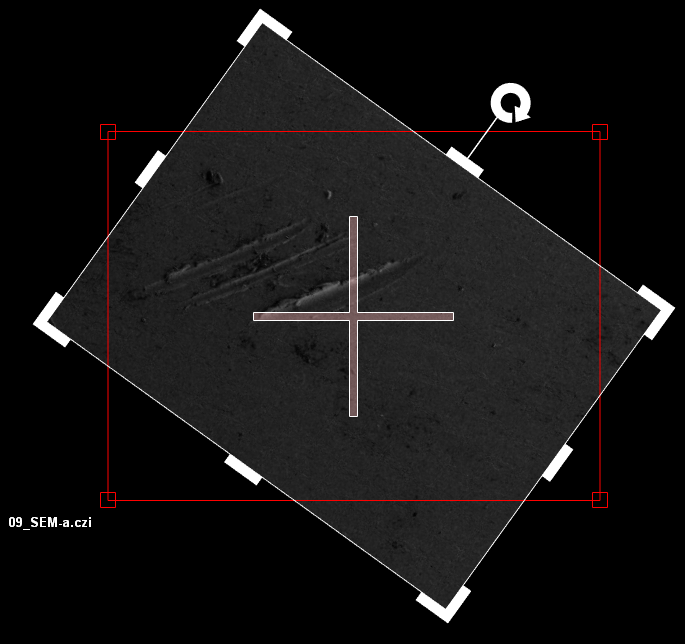 Rotated dark rectangular SEM image with central white crosshair, red rectangle, white edge markers and label 09_SEM-a.czi